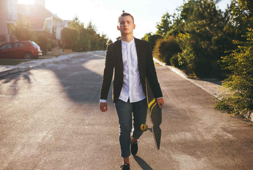 Main character energy search trend shown by a person walking confidently alone outdoors