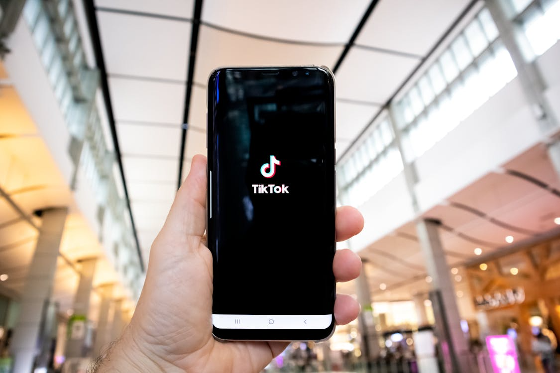 TikTok to Google pipeline shown by a phone displaying the TikTok app