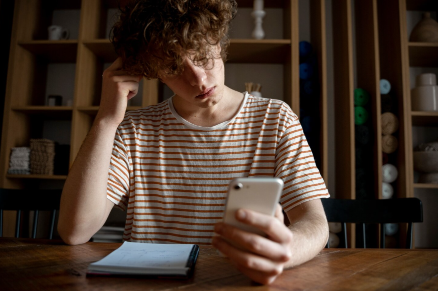 Person reviewing information on a phone during explainer searches for clarity and context